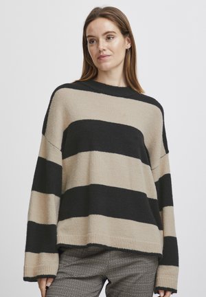 Maglione a righe beige e nero, con una vestibilità rilassata, scollo rotondo e maniche lunghe con polsini e orlo a coste. Tessuto morbido e testurizzato.