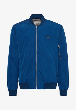 Giacca bomber blu con una finitura liscia e lucida, polsini e orlo a coste, chiusura frontale con zip e tasca con zip sul maniche sinistro.