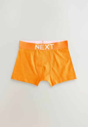Orange boxer shorts with a fitted design, featuring an elastic waistband in a matching shade, labeled with the word "NEXT."