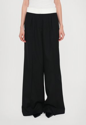ELIA HERRINGBON - Trousers - black