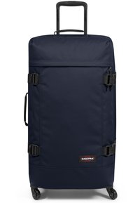 Valigia a rotelle blu navy realizzata in tessuto resistente, con manico retrattile, due fibbie laterali e un'etichetta con logo.