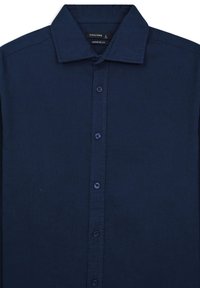 Marineblaue Hemdjacke aus strukturiertem Stoff. Mit klassischem Kragen und sechs passenden Knöpfen entlang der gesamten Länge. Reguläre Passform.