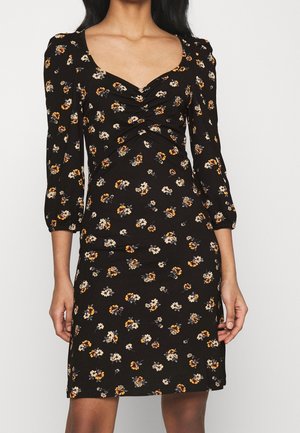 Black floral dress with three-quarter sleeves, featuring a ruched front, small white and orange flower patterns, and a fitted shape.