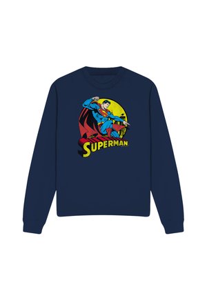 Navy blue sweatshirt featuring Superman in blue and red suit with cape, flying in front of yellow circle and cityscape, text "SUPERMAN."