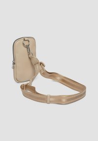 Beige leather crossbody bag with a zipper closure, adjustable metallic strap, and textured surface details. Compact and rectangular shape.