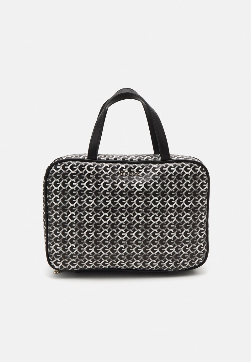 Borsa a strisce bianco e nero con due manici neri, forma rettangolare e chiusura con zip. Presenta un logo lucido sul fronte.