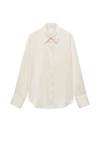 Chemise à manches longues de couleur crème, dotée d'un col pointu et d'une fermeture boutonnée à l'avant. Confectionnée dans un tissu lisse avec une coupe légèrement ample.