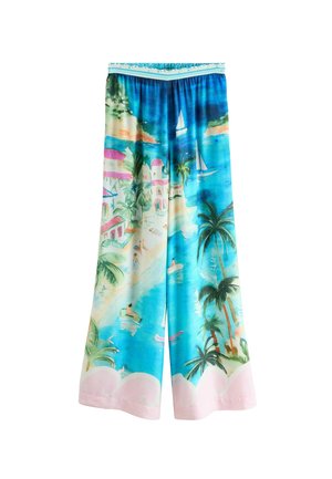 Colorful wide-leg pants featuring a tropical beach scene with palm trees, boats, and houses in vibrant blues, greens, and pink accents.