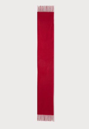 Longue écharpe rouge unie avec de fines franges aux deux extrémités sur un fond clair.