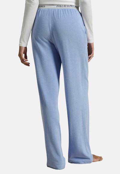Světle modré pohodlné kalhoty s elastickým pasem, s kontrastním černým logem "Polo Ralph Lauren". Měkká, strukturovaná tkanina.