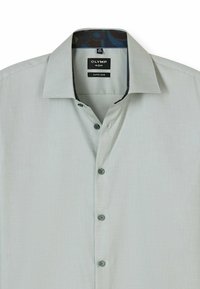 Hellgraues, super-schmal geschnittenes Hemd aus strukturiertem Stoff. Verfügt über einen klassischen Kragen, eine Knopfverschluss und eine gemusterte Innenkragenverkleidung.