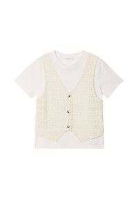 Crocheted cream vest with five buttons over a white short-sleeve t-shirt. The vest has a textured pattern and a curved hemline.