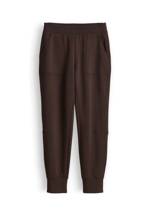 Pantaloni jogger marrone scuro con fascia elastica in vita, tasche applicate frontali e polsini a coste alle caviglie, mostrati distesi su sfondo bianco.