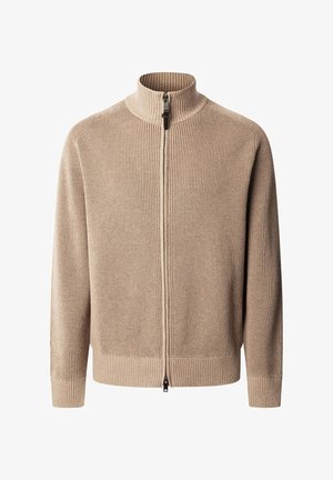 Pull zip-up beige côtelé avec un col montant, présentant une texture lisse et une fermeture éclair contrastante. Coupe slim avec des manches longues et sans poches.