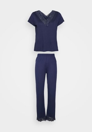 Navy loungewear set featuring a short-sleeved top with a lace V-neck and matching pants with lace trim at the hems. Soft, stretchy fabric.
