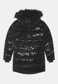 Black puffer jacket with a shiny finish, featuring a fur-trimmed hood, ribbed cuffs, and horizontal quilting. Logo visible on the back.