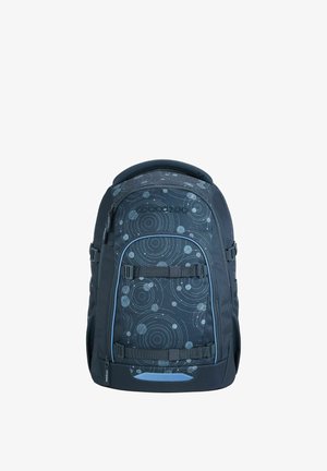 Black backpack with a circular pattern in lighter shades, featuring adjustable straps, a top handle, and a zippered compartment at the bottom.