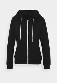 Felpa nera con zip realizzata in tessuto morbido, dotata di una tasca frontale, lacci bianchi e polsini e orlo a costine. Design semplice, senza motivi.