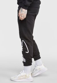 SIKSILK SCRIPT EMBROIDERY - Pantaloni sportivi - black