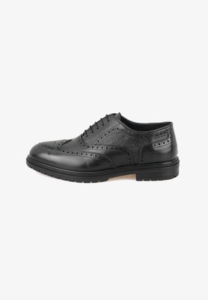 Schwarze Leder-Halbschuhe mit Broguemuster, strukturierten Seiten, runder Spitze und robuster Gummisohle. Die Schnürsenkel sorgen für einen sicheren Halt.