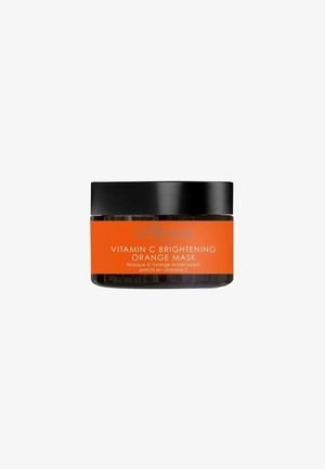 Vitamin C Brightening Orange Mask in a clear jar with a black lid. Features an orange label featuring text in white and orange.