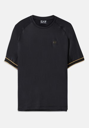 Black athletic t-shirt with short raglan sleeves, featuring a textured fabric, gold accent stripes, and a small EA7 logo on the front.