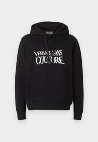 Sort hættetrøje med lange ærmer og hvid "Versace Jeans Couture" tekst på brystet, med snoretræk i hætten.