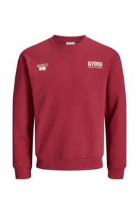 Rode katoenen sweatshirt met lange mouwen. Heeft witte tekstafbeeldingen: "KYOTO", coördinaten, en "ALLEN GOEDE VIBRATIES GEACCEPTEERD." Klassieke ronde hals.