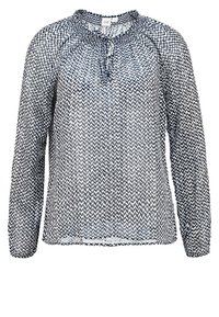 Blusa a maniche lunghe in tessuto trasparente blu navy con motivo zigzag bianco a contrasto, scollatura arricciata con laccetto e vestibilità leggermente ampia.