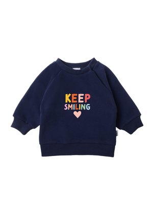 Marineblaues Sweatshirt mit rundem Halsausschnitt und lockerer Passform. Verfügt über mehrfarbigen Schriftzug "BEHALTE DEIN LÄCHELN" und ein Herz-Graphic auf der Vorderseite.