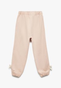 Pantalones de chándal rosa claro con una cinturilla elástica, puños ajustables con cordón y una textura suave. Diseñados para la comodidad y la facilidad de movimiento.