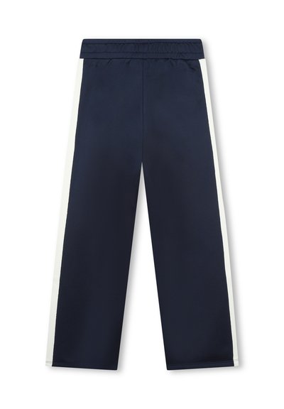 Pantalons de sport bleus marine avec une bande blanche sur le côté, taille élastique, coupe droite et texture lisse. Aucun poche ni détail décoratif.