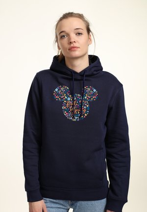 Felpa blu navy con un design floreale di Topolino al centro. Realizzata in materiale morbido, presenta una tasca frontale e cappuccio con cordino.