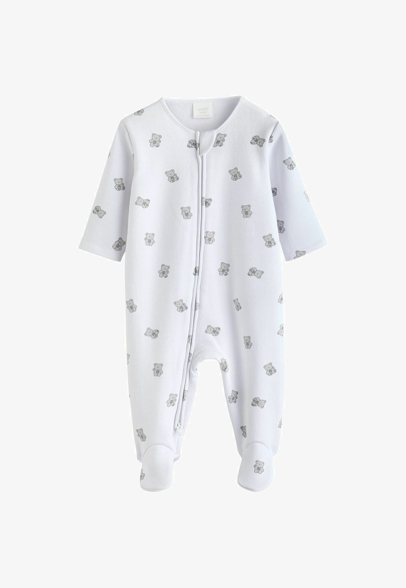 Tutina bianca realizzata in morbido tessuto con un motivo di orsetti grigi. Maniche lunghe e design con i piedi, con chiusura frontale a scatti.