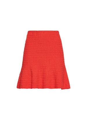 Red flared skirt with a textured, ribbed fabric. Features a fitted waist and a hem that flares out slightly towards the bottom.