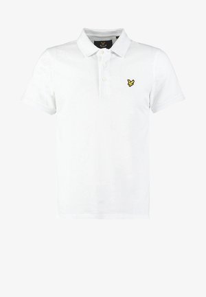 Hvid polo-shirt lavet af bomuld, med en tre-knaps lukning, korte ærmer og et lille gult logo på venstre bryst.