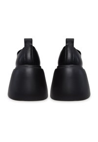 Black leather shoes with a smooth, rounded toe and a chunky heel. The back features a fabric tab for easy wear.