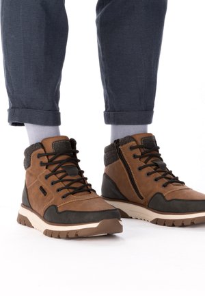 Rieker Bottines à lacets - braun