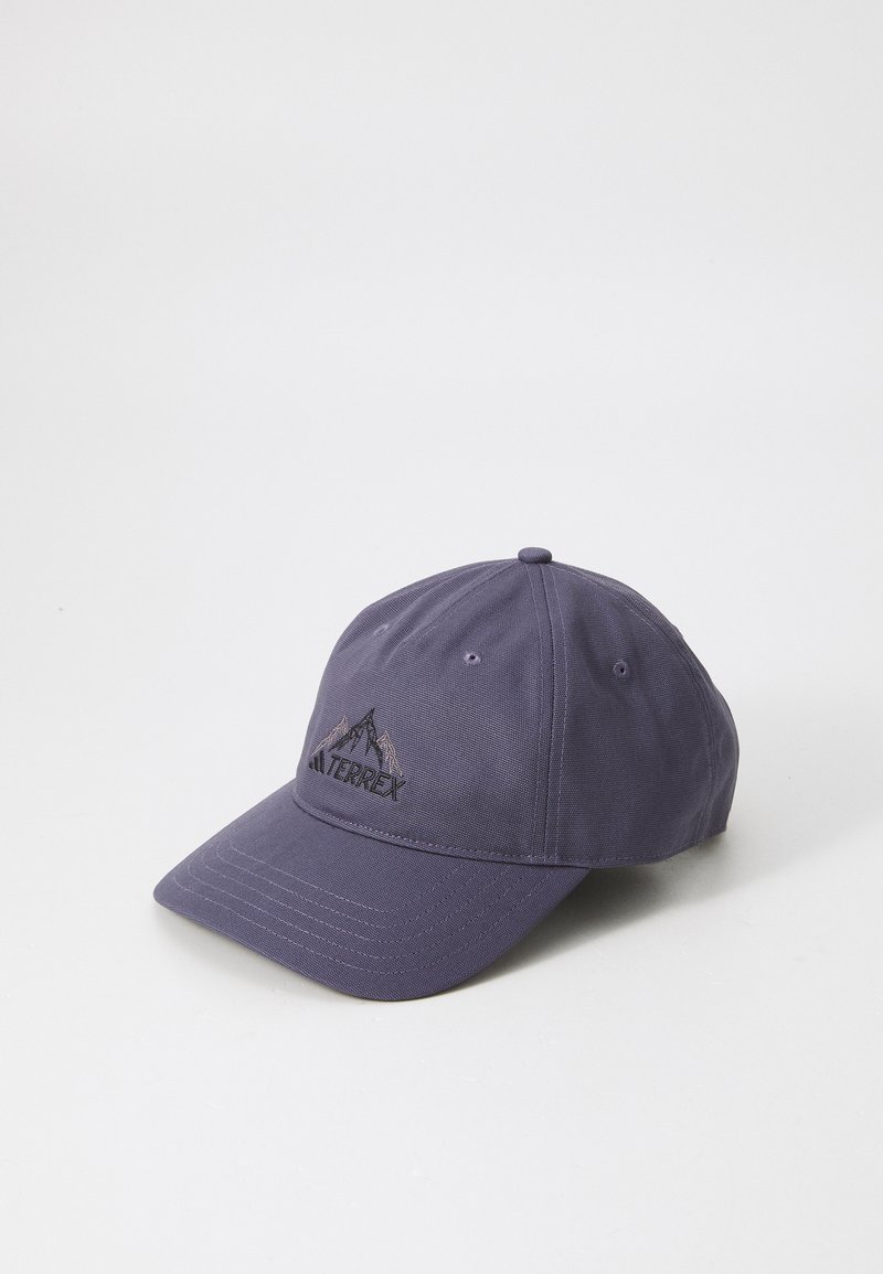 Purple baseball cap made of textured fabric, featuring a stitched mountain logo and adjustable strap at the back.