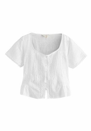 Next, Pluus - white
