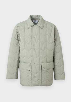 Light green quilted jacket with snap-button front, two flap pockets with snap buttons, and a pointed collar.