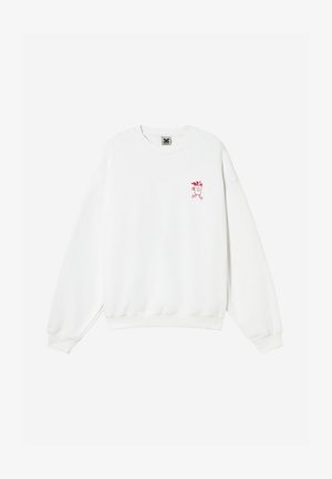 Fehér, hosszú ujjú, kerek nyakkivágású pulóver, a bal mellrészen egy kis piros, futó csészét ábrázoló grafikus motívummal.