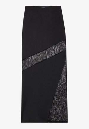 Schwarzer Midirock mit geometrischem Design, strukturierten Spitzen-Einsätzen, strukturiertem Stoff und einer schlanken Silhouette.