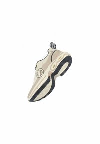 Sneaker met een crèmekleurige bovenkant en zwarte accenten, een gestructureerd ontwerp, opvallende dempingdetails en een stevige zwarte rubberen zool.