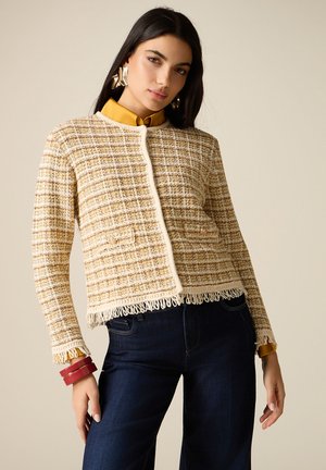 CON FRANGE - Chaqueta de punto - beige
