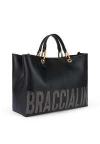 Borsa tote in pelle nera con hardware dorato, doppi manici e lettering in strass che compone la parola "BRACCIALINI" sulla parte anteriore.