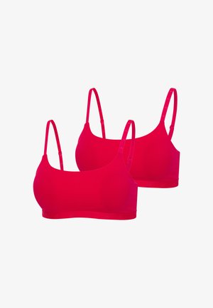 Zwei hellrote drahtlose Bralettes mit verstellbaren Trägern auf weißem Hintergrund.