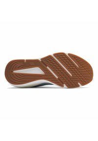 Suela de zapato con un patrón texturizado y surcos, material de caucho marrón y una entresuela blanca para amortiguación y tracción.