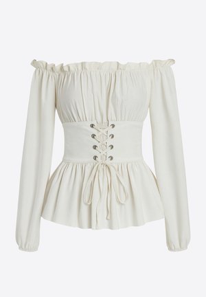 Blusa de escote barco en tela color crema con mangas largas fruncidas. Cuerpo entallado con cierre de encaje frontal y bajo con volante acampanado.