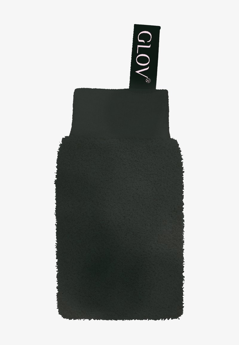 Gant exfoliant texturé noir avec un bracelet en tissu noir et une boucle étiquetée « GLOV » sur fond blanc.